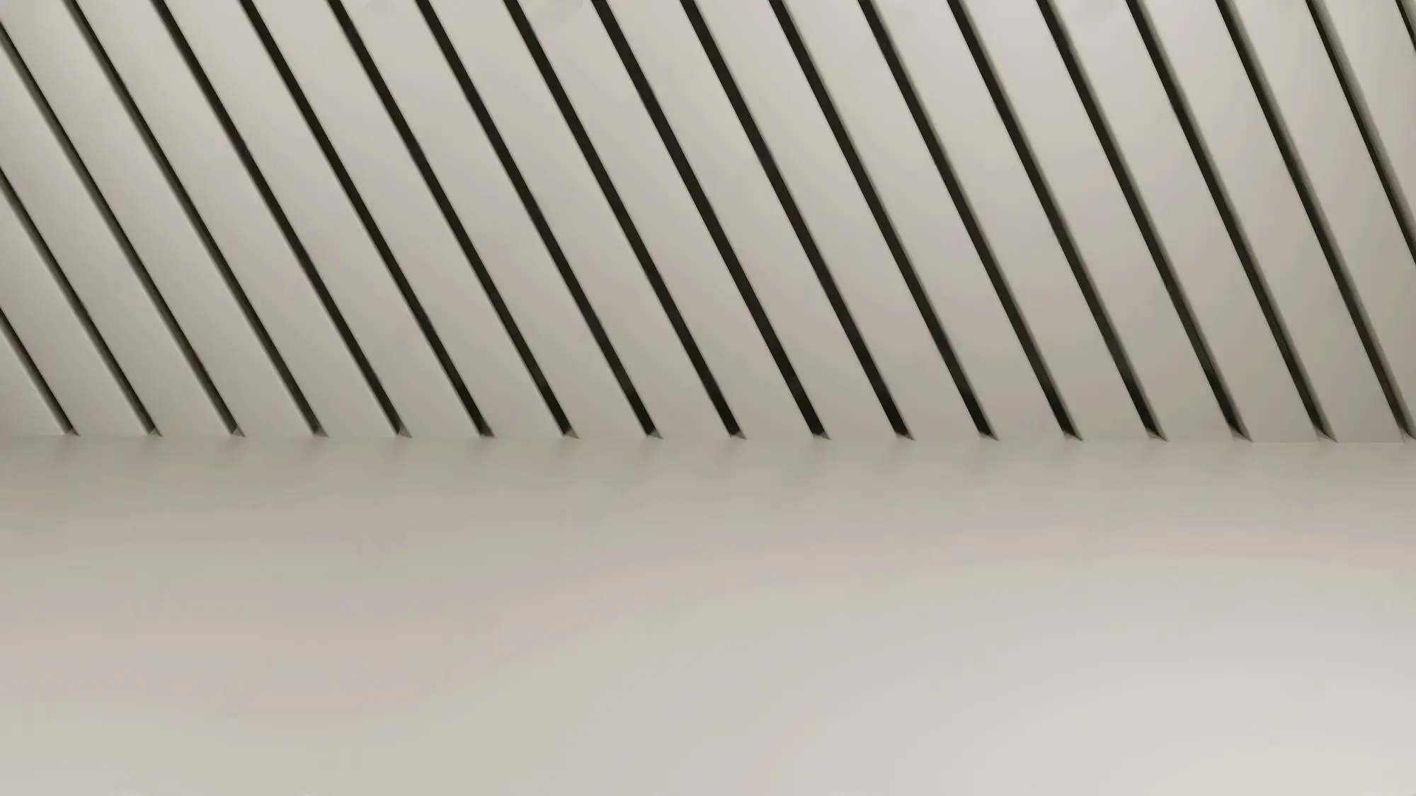 Fluted wall panel finish on ceilings and column box-up details in a premium interior.