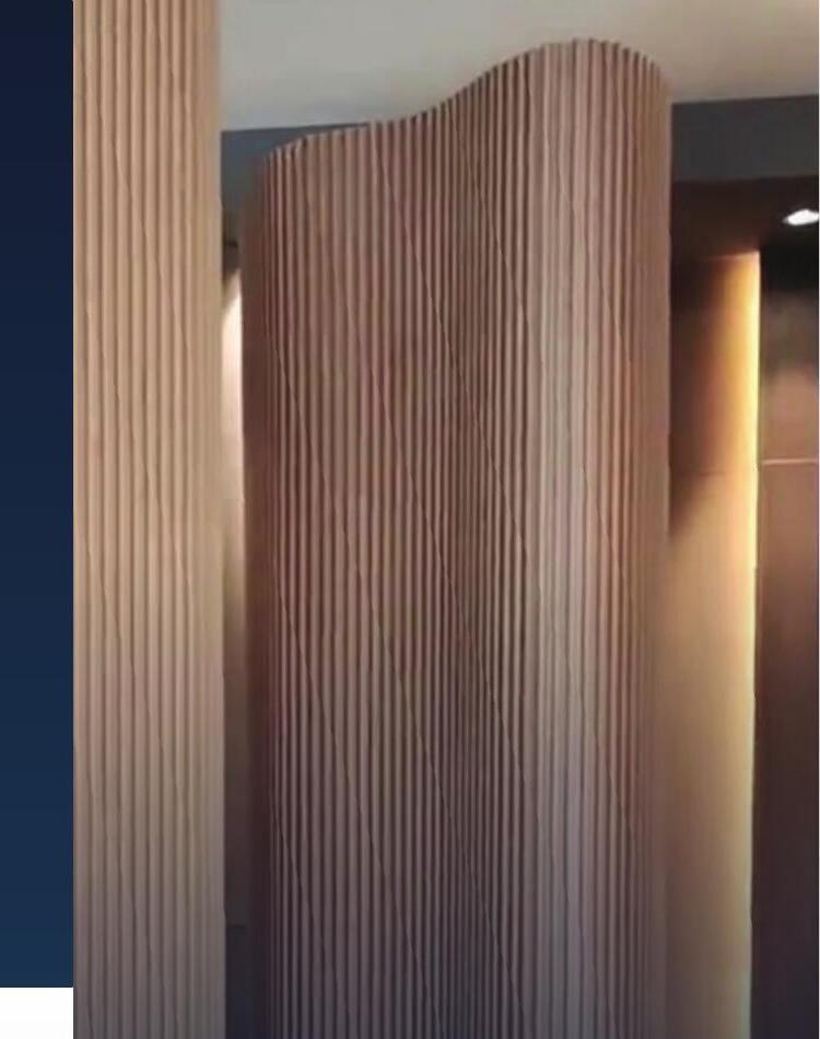 Decorative fluted wall panel system installed on a curved column in a Malaysian commercial interior